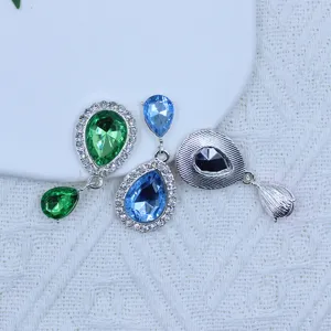 Close-up detail view of colorful teardrop rhinestone pendant jewelry making accessories, DIY crafts.