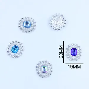 Close-up detail of alloy rhinestone flower button with crystal center and pearl border 19x23mm.