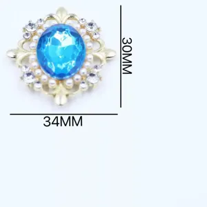 Close-up detail of blue crystal rhinestone alloy button with pearl trim for DIY crafts.