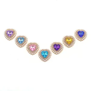 Heart rhinestone pearl DIY jewelry buttons, sparkling crystal craft accessories detail view.