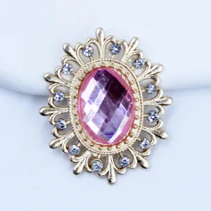 Detailed close-up of gold oval hollow alloy rhinestone DIY jewelry accessory charm.