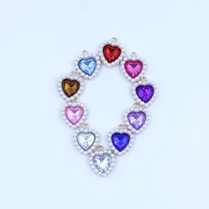 Colorful heart-shaped alloy pendants with delicate pearl borders, perfect for DIY jewelry making.