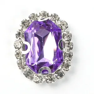 Close-up detail of oval purple rhinestone crystal button for DIY craft sewing decor.