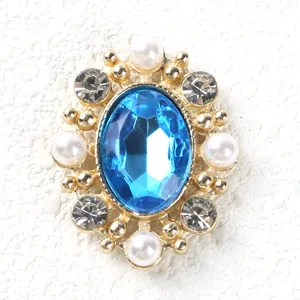 Vintage oval rhinestone alloy button with blue gem, pearls and clear crystals for DIY crafts.