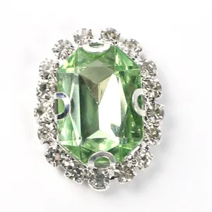 Close up of oval rectangular octagonal rhinestone claw chain button detail for DIY crafts.