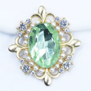 Gold alloy rhinestone button, green oval acrylic gem, pearl trim, DIY hair accessory craft.