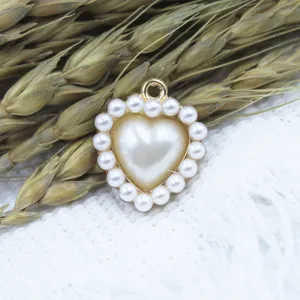 Close-up view of the alloy heart-shaped pearl pendant charm, perfect for DIY jewelry making.