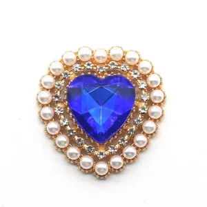 Heart-shaped alloy rhinestone button with blue acrylic crystal and faux pearls for DIY crafts.