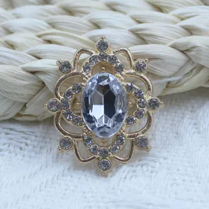 Alloy rhinestone flower pendant detail, vintage hollow DIY jewelry accessory close up.