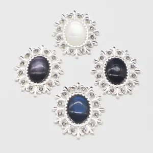 Oval hollow alloy rhinestone resin cat-eye decorative buttons for DIY hair bows and clothing.