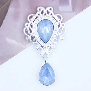 Detail view of 48x26mm silver hollow shield pendant metal alloy rhinestone DIY accessory.