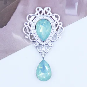 Silver hollow shield metal pendant with light blue crystal rhinestones, detail shot