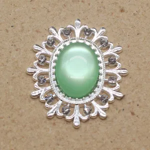 Oval alloy filigree resin cat-eye rhinestone decorative buckle for DIY craft hair accessories.