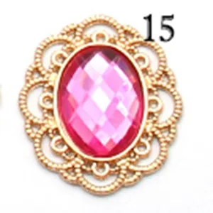 Pink oval acrylic rhinestone with gold hollow filigree metal base DIY jewelry accessory.