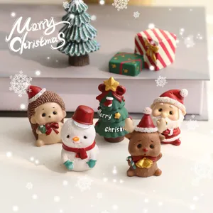 Christmas resin miniature set with snowman, reindeer and Santa for desktop holiday decor.