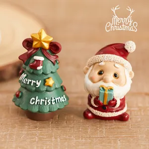 Christmas resin ornament set featuring cute Santa and tree figurines for holiday desktop decor.