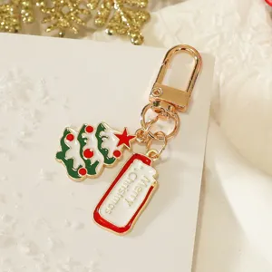 Christmas tree metal keychain with festive tag pendant, cute holiday key ring ornament gift.