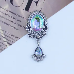 Vintage silver alloy rhinestone oval acrylic pendant detail with iridescent crystal and floral decor.