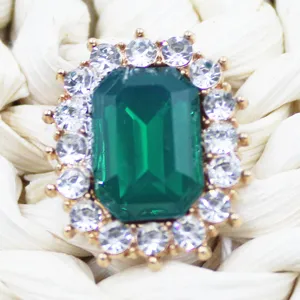 Rectangle green crystal rhinestone button alloy DIY hair accessory trim detail shot.