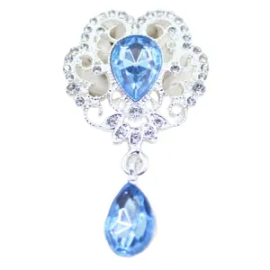 Alloy flower brooch pendant with blue teardrop crystal and sparkling rhinestones for DIY crafts.