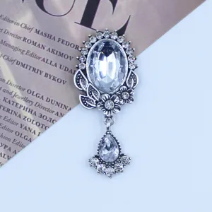 Vintage silver alloy rhinestone oval pendant detail view, clear crystal DIY craft component.