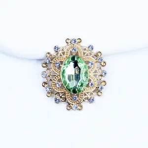 Vintage gold-tone alloy oval green crystal rhinestone button DIY bow hair accessory charm.
