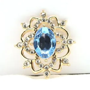 Oval gold alloy flower tray DIY jewelry accessory with central blue resin and clear rhinestones
