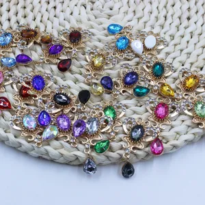 Close-up of gold alloy rhinestone crystal drop flower pendant DIY craft jewelry detail shot.