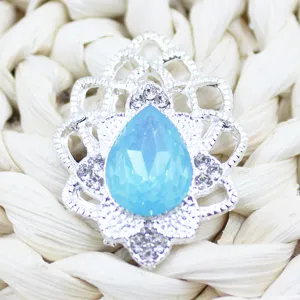 Silver alloy teardrop openwork acrylic rhinestone decorative accessory detail shot.