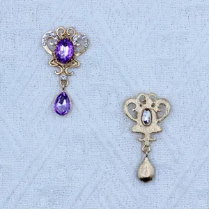 Detail view of the gold zinc alloy rhinestone oval acrylic pendant DIY accessory.