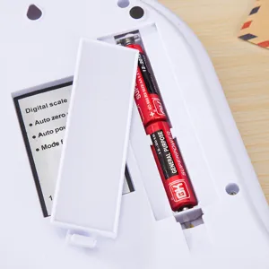 Digital kitchen scale replacement battery compartment view, precision food weighing device part.