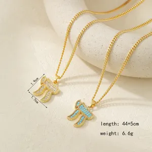 Hebrew Chai pendant necklace detail view, gold dual chain with sparkling cubic zirconia stones.
