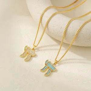 Elegant gold-plated Hebrew Chai pendant necklace featuring sparkling clear and turquoise stones.