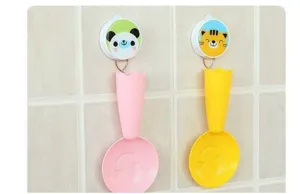 Bonita cuchara de arroz de pie con soporte de animales, paleta antiadherente de plástico.