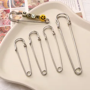 Thickened safety pins set with letter beads and smiley face charm for DIY jewelry making crafts.