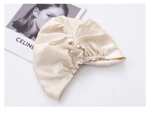 Beige silk satin sleeping cap for hair care, soft elastic night bonnet, detail view