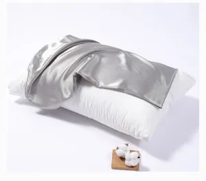 Detailed view of luxury silver silk-like pillowcase showing soft fabric and smooth zipper.