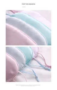Detail view of smooth satin sleep masks with adjustable ear loops and soft pastel colors.