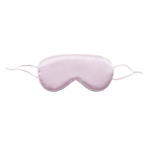 Pink silk sleep mask with adjustable ear loops for comfortable shading and travel rest.
