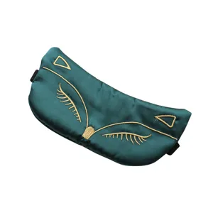 Masque de sommeil en similicuir vert foncé avec broderie renard dorée, lanière réglable.