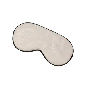 Masque de sommeil en soie respirant, cache-yeux occultant avec motif paisley et bordure noire.