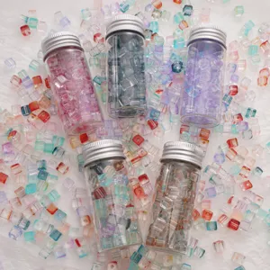 Gradient crystal square loose beads in glass bottles set for DIY handmade jewelry crafting.