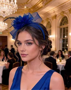 Closeup detail of elegant navy blue feather mesh fascinator headband worn at banquet.