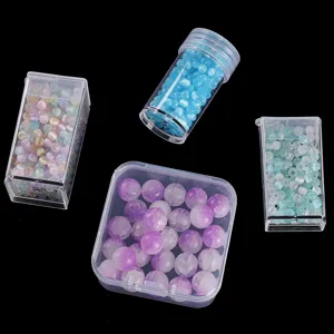 Clear plastic storage boxes with colorful beads for DIY crafts, nail art, and jewelry organization.