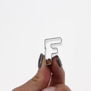 Detail view of stainless steel letter F cookie cutter, perfect for baking and fondant.