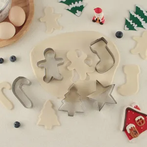 Stainless steel Christmas cookie cutter detail shot, baking mold tool set for festive DIY.