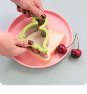 Stainless steel cartoon dinosaur sandwich cutter mold for bread, fruit and baking fun.