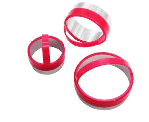 Stainless steel round cookie and mousse cake mold set with red plastic handles for baking.