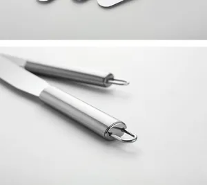 Stainless steel cake spatula handle detail, professional baking palette knife close-up shot.