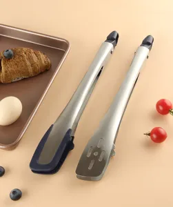 Stainless steel kitchen food tongs detail shot, featuring silicone grip and slotted design.